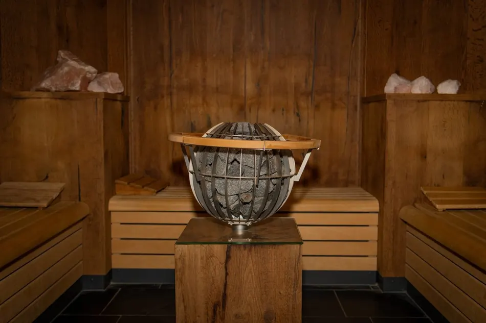 Sauna with a round stove and salt stones